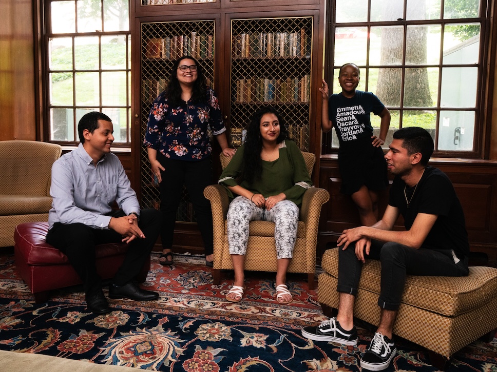 Decorative photo of Scholars' Lab fellows posing in the library